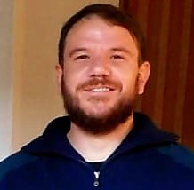 Ricardo smiling into camera